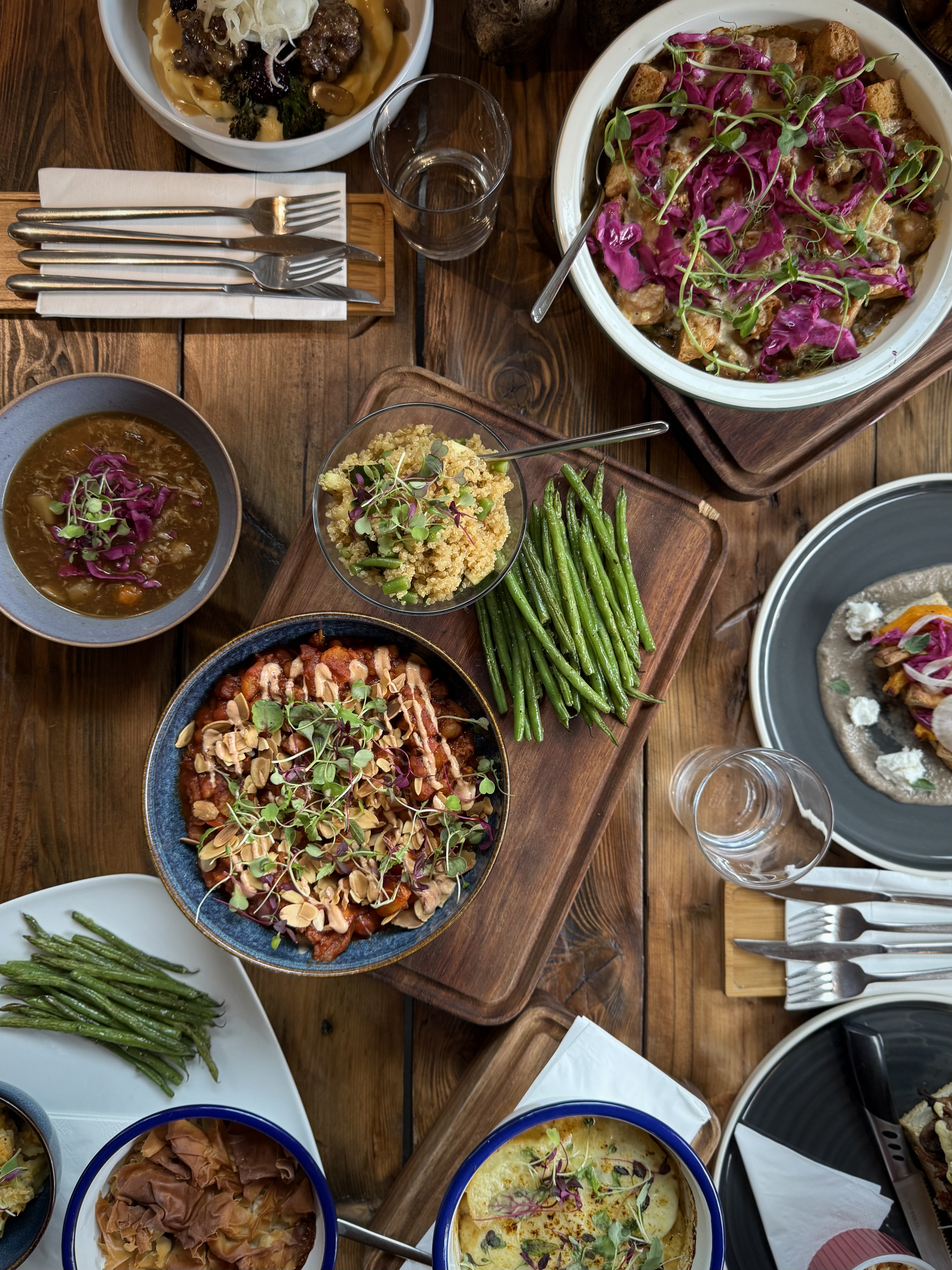 Birdseye view of a table covered in different dishes of food.